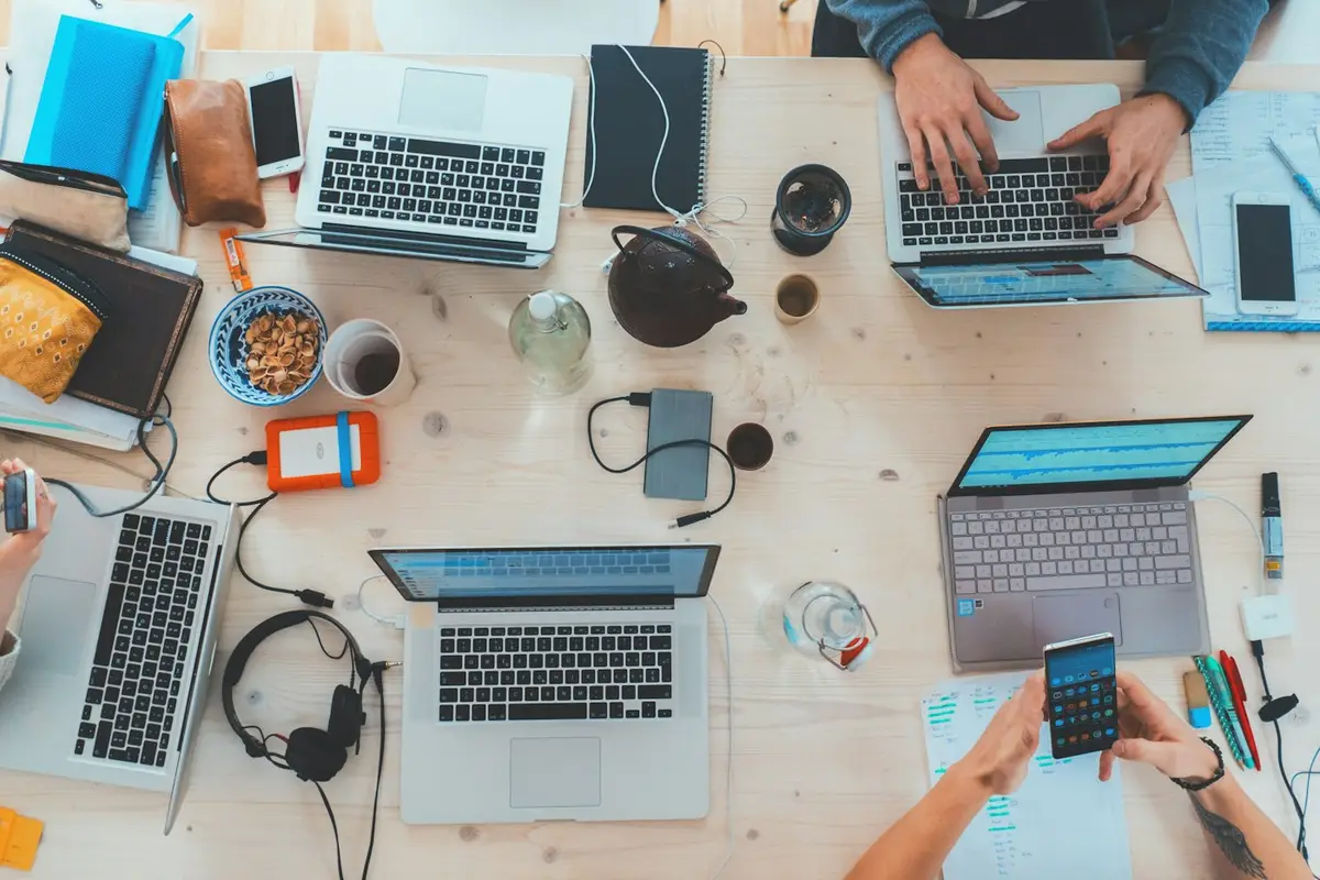 Developers working together at computer monitors