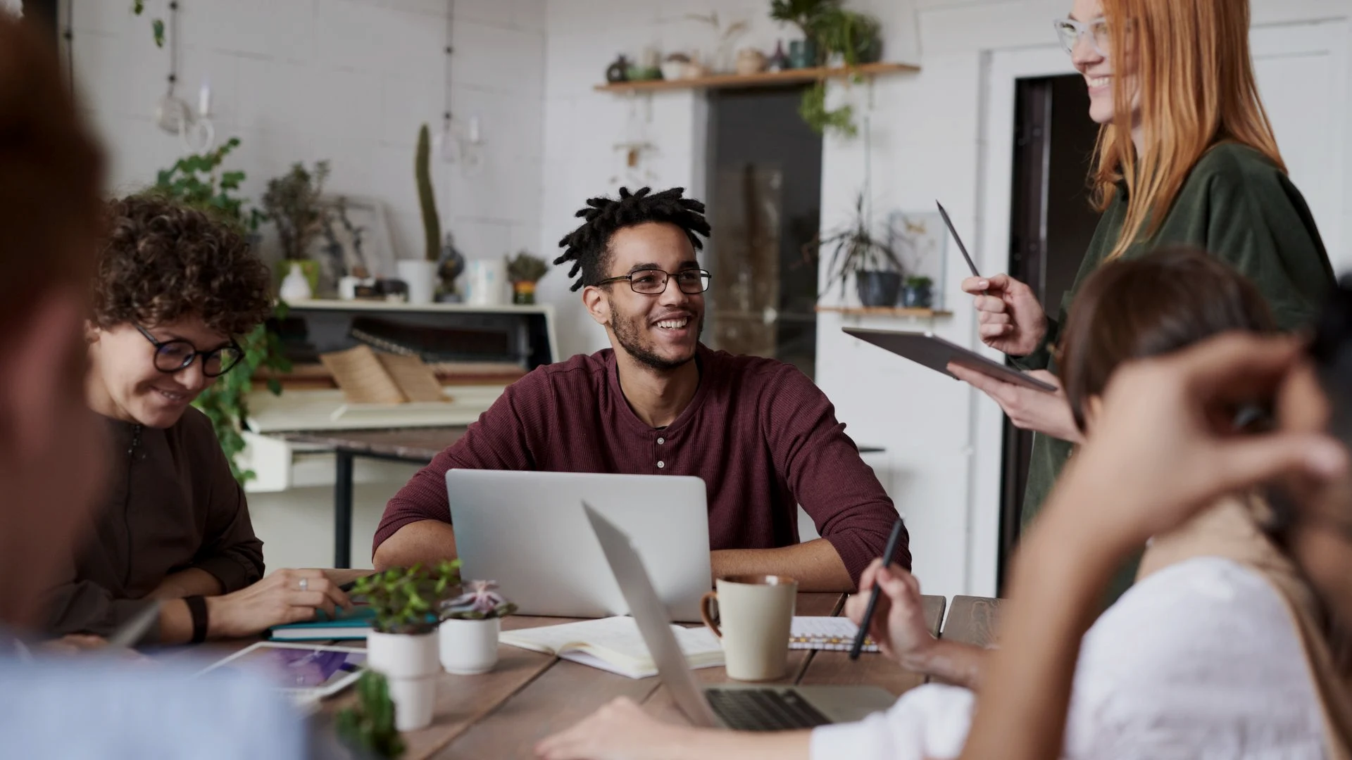 Pilot team testing a streamlined expense approval workflow together at a conference table