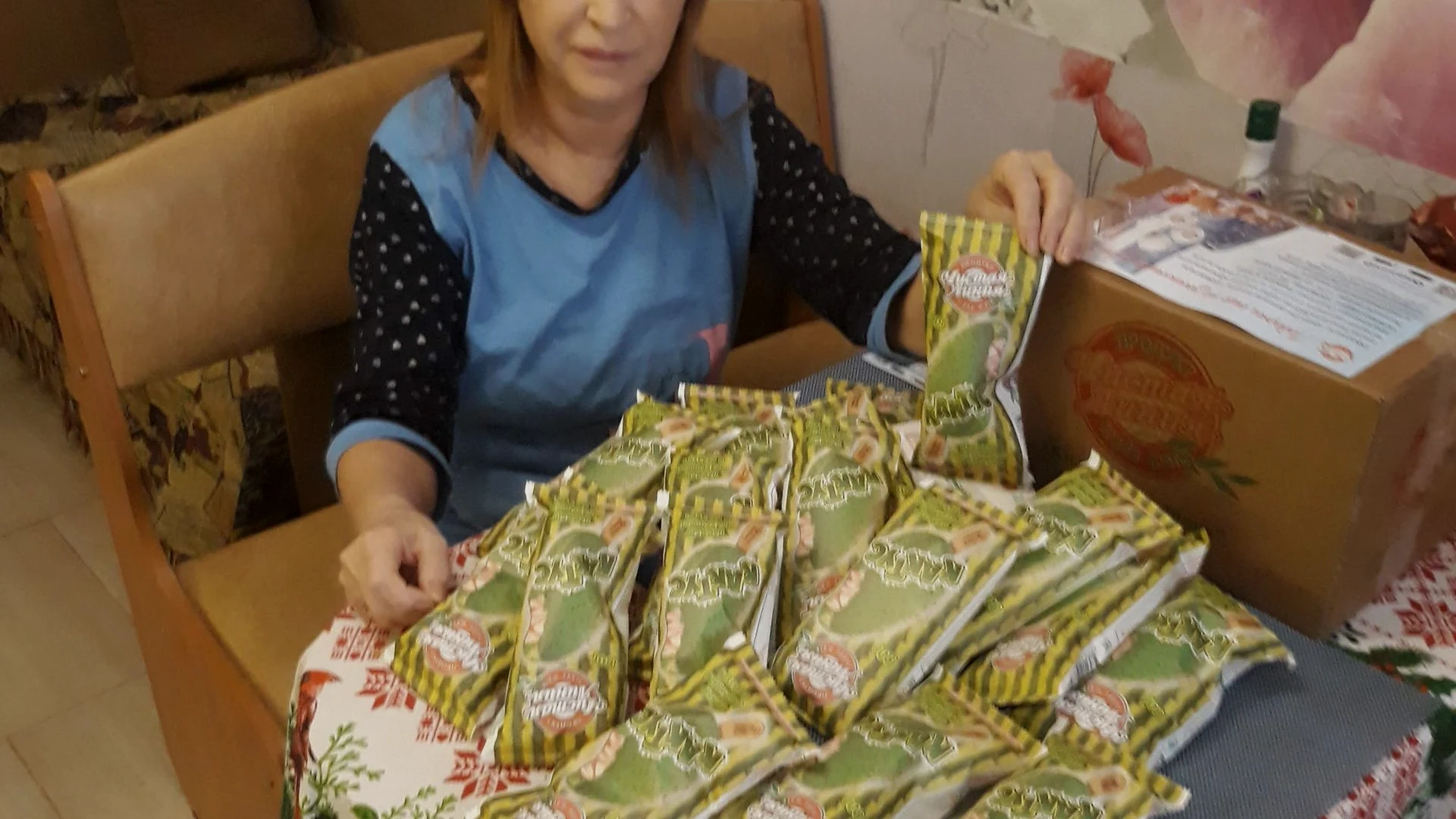 Warehouse associate packing online retail orders into shipping boxes before e-commerce store go-live